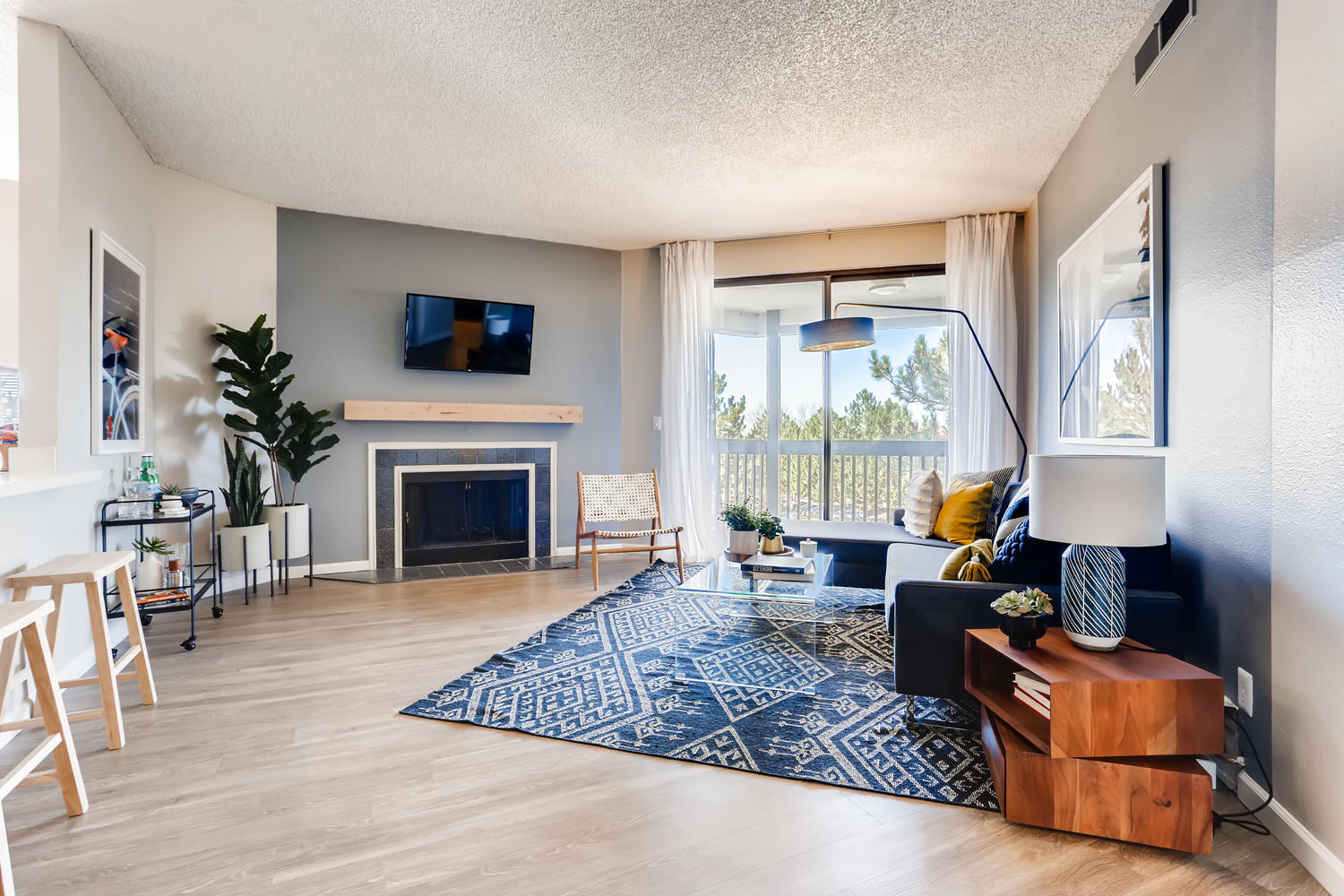 Living room with fireplace and balcony