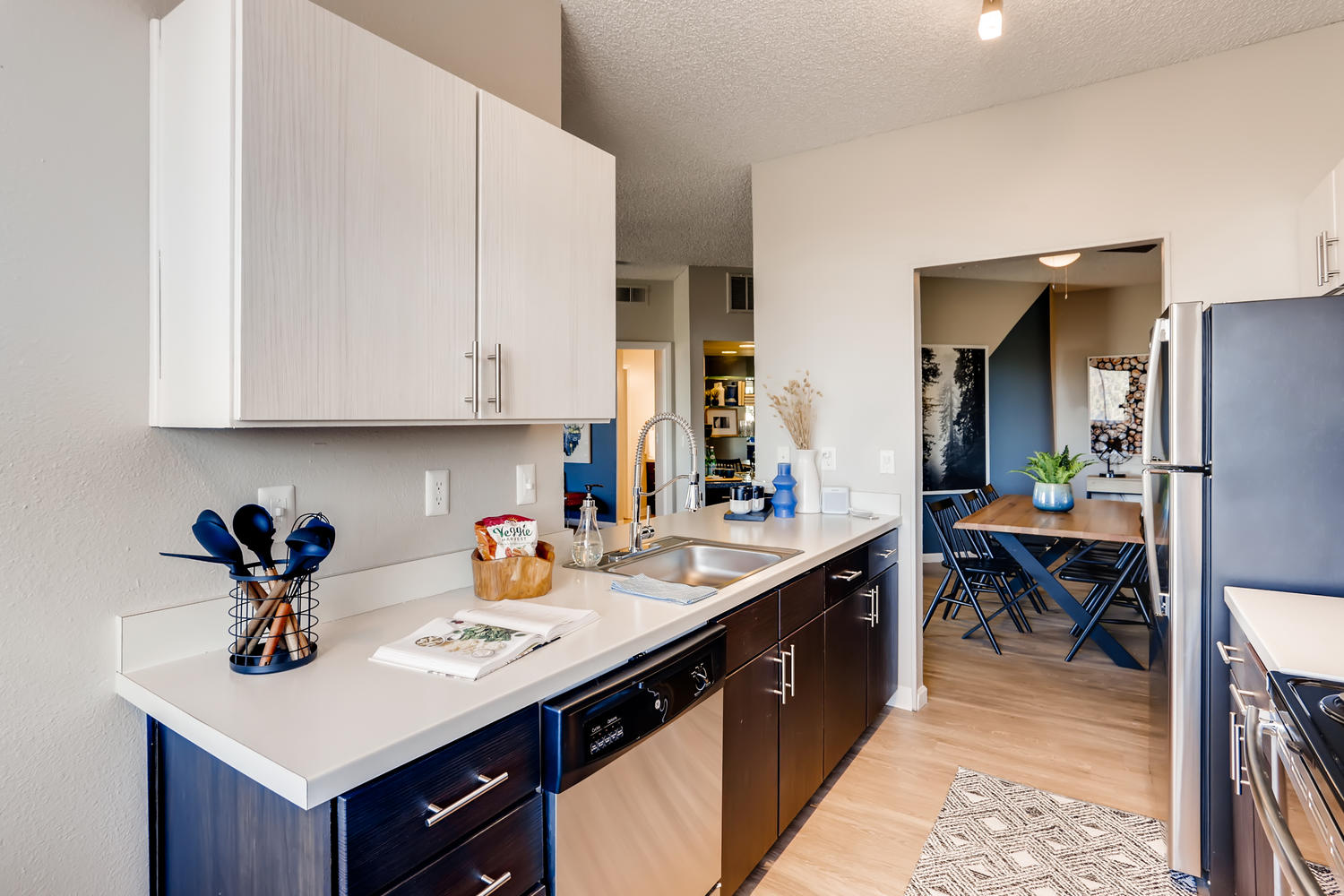 Kitchen with stainless steel appliances and tile backsplash